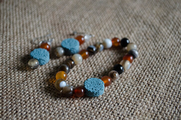 Bracelet and balls made of natural stone agate carnelian lava.