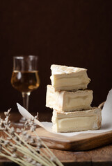 Homemade Vegan cheese on rustic black background. Copy space, close up.