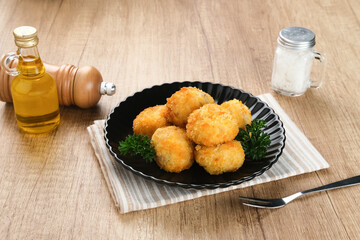 Delicious Bitterballen, typical Dutch snacks made from flour, cheese, milk coated with bread crumb filled with mozzarella.
