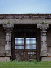 Fototapeta premium Selective focus on the wall and gate, this photo has taken from Nandi hills in India 