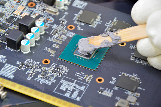 The image of a technician filling a silicon cooling chip CPU.