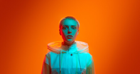 Futuristic female model under neon light