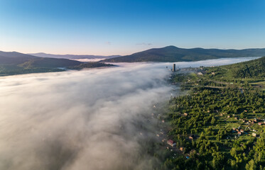 Summer city Sheregesh hotel Kemerovo region, Russia Aerial top view with fog