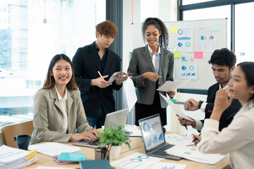 Group of young businessman talking with young and mature colleagues in boardroom at meeting. brainstorming, discussing analyzing business strategy concept.