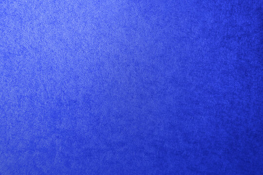 Solid navy blue tone color gradation paint on corrugated cardboard box paper texture background with space