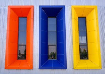 Obraz premium vertical colorful windows, orange, blue, yellow, frame
