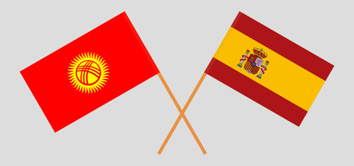 Crossed flags of Kyrgyzstan and Spain. Official colors. Correct proportion