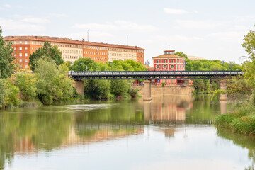 Fototapeta premium Scenic view of River Ebro and Puente de Hierro as it flows through out Logroño, La Rioja, Spain