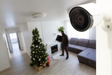 CCTV Camera Showing A Burglar Stealing Things In The House.