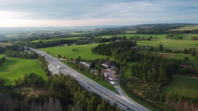 Aerial drone view of famous highway or expressway D1 in Czech Republic, saturated sunset colors, zoom out
