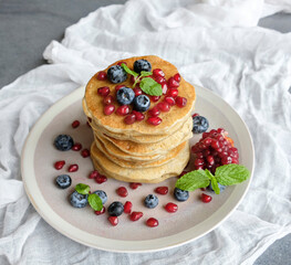 Homemade breakfast meal. Blueberry Pomegranate Pancake. Eaten with raw wild honey syrup. For those on diet, stay healthy for a cleaner lifestyle