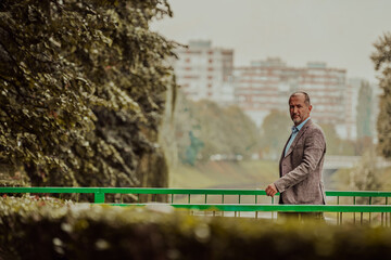 Fototapeta premium focused businessman in suit walking in urban environment.