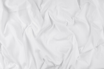 White fabric. luxurious white fabric texture background. Creases of satin, silk, and cotton.