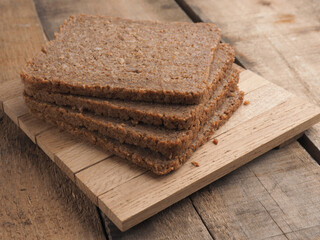 Wholemeal rye bread on a rustic wooden table