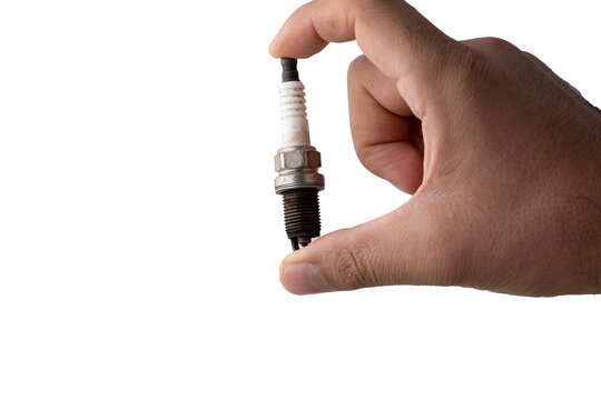 hand holding a motor engine spark plug