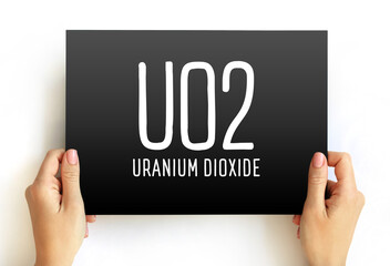 UO2 - uranium dioxide acronym text on card, abbreviation concept background