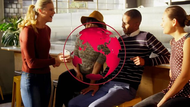 Animation of globe over diverse business people at office