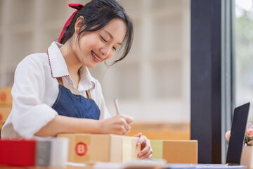 SME entrepreneur Small business entrepreneurs Online selling ideas,Happy Young Asian business owner...
