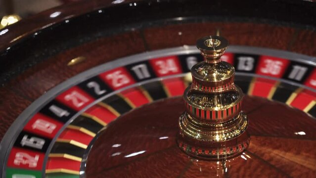 Roulette in casino spinning with ball on number six, closeup view