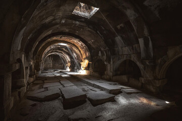 Fototapeta na wymiar Dark hall of the Selim Caravanserai in Armenia