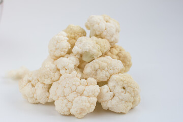 fresh cauliflower on a white background. A useful fortified vegetable for weight loss