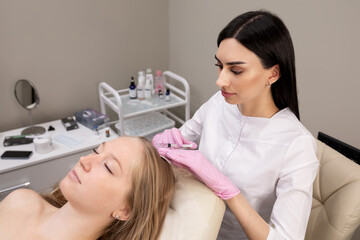 woman in salon doing mesotherapy of hair