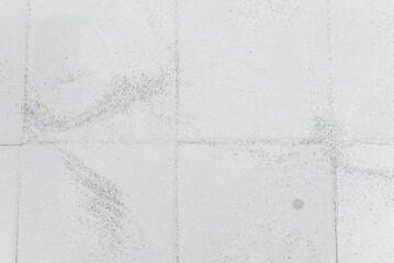 Polymeric paver sand on top of gray concrete patio stone paver brick walkway in Texas, USA