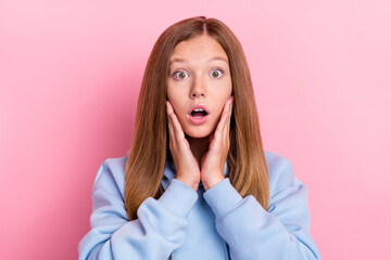 Closeup photo of young funny face cute girl brown hair touch cheekbones open mouth scared watching you isolated on bright pink color background