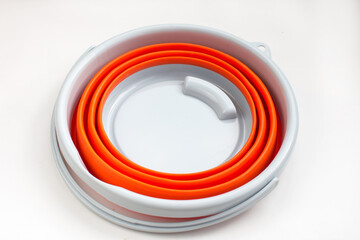Orange folding bucket silicone bucket. For tourism, hiking and fishing
