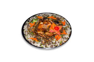 full roasted turkey served on a tray of rice, and green peas.