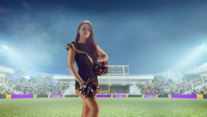 Group of cheerleaders in action on  stadium in night