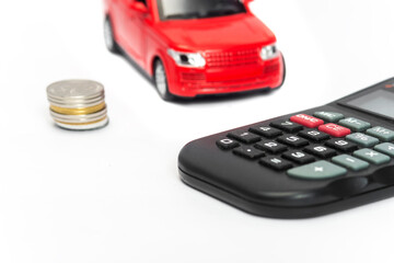 red car and calculator on white background . insurance concept