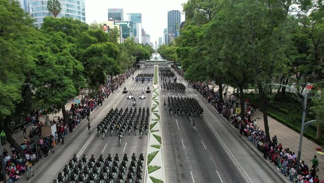 aerial drone shot of various combat platoons during the military parade in mexico city