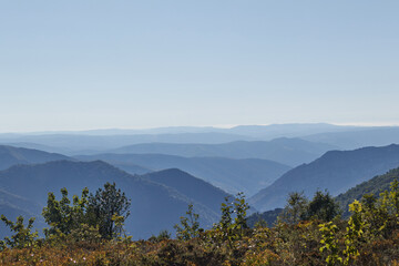Mountain peaks flee to the horizon similar to waves