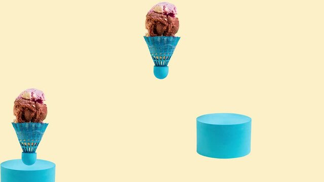 Badminton shuttlecock filled with ice cream falls on a blue moving roller on a yellow background. 4k animation. Abstract concept.