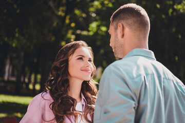 Photo of adorable sweet husband wife dressed casual clothes smiling looking eyes enjoying sunshine ready kissing outside backyard