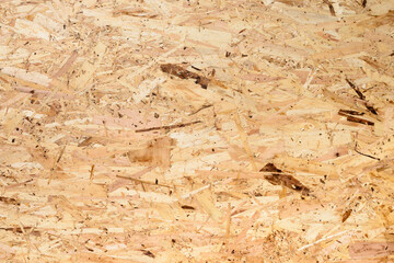 The texture of the oriented strand board (OSB) building material.