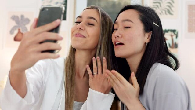 Friends taking selfie with a phone on the wedding morning preparing for the day together in room. Event, smile and happy bride showing her ring while taking picture with her best friend on smartphone
