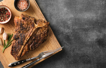 Juicy porterhouse steak grilled with pepper and salt. T-bone steak.