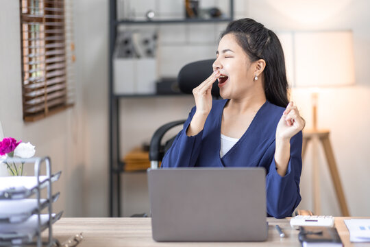 Tired Sleepy Young Business Woman Yawning, Working At Workplace In Office Overwork And Sleep Deprivation Concept