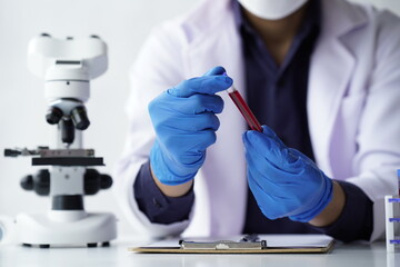 Lab worker preparing test blood for detection of antibodies and infections Corona virus.
