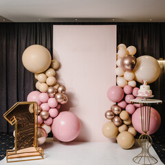 Arch decorated with pink, brown, and gold balloons. Trendy Cake for a girl. Copy space. Birthday...