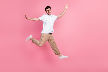 Full length photo of attractive cheerful satisfied man hurry up big black friday sale shopping empty space isolated pink color background