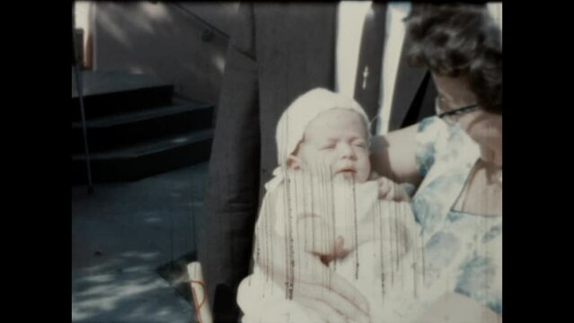 Infant Nephew 1964 - A woman holds her infant nephew in Canoga Park, California in 1964. 