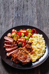 beef steak with potato mash and roasted vegetables