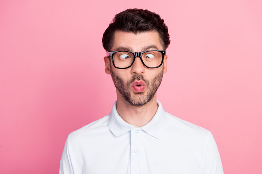 Closeup photo of young attractive handsome nice positive face grimacing guy pouted lips childish look his nose joke comic isolated on pink color background
