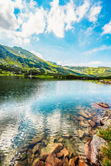 Tatra National Park in Poland. Tatra mountains panorama, Poland colorful flowers and cottages in...