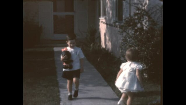 Leaving With Mom 1962 - Siblings leave their house with their mother in Canoga Park, California in 1962.