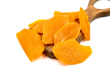 Dried mango slice isolated on white background. Dried fruit in sunlight. close up