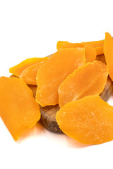 Dried mango slice isolated on white background. Dried fruit in sunlight. close up